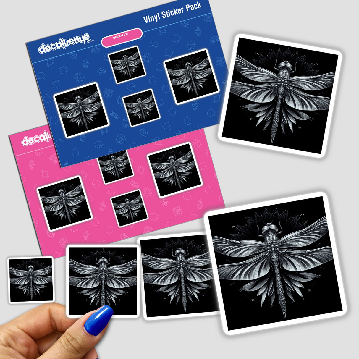 Hand holding a dragonfly sticker pack, showcasing intricate dragonfly drawings. Available as stickers or digital artwork from Decal Venue.