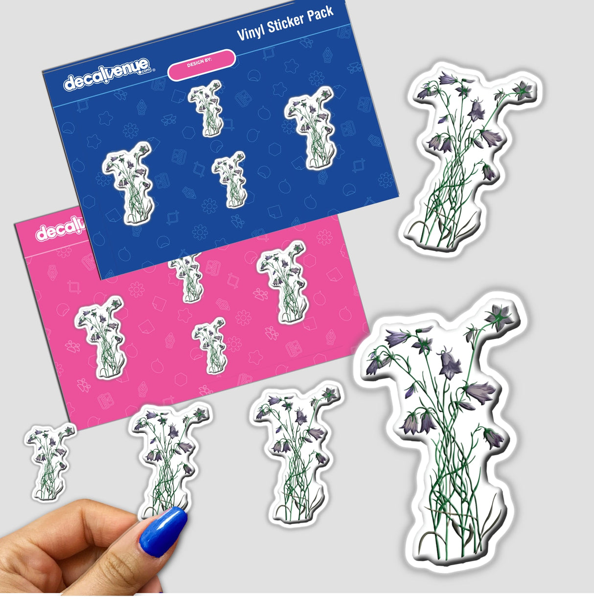 American Wild Flowers sticker pack held in hand, featuring various flower designs. Available as stickers or digital artwork from Decal Venue, known for unique stickers and digital art.