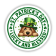 St Patricks Lucky and Blessed Goldendoodle wearing a green hat adorned with clovers, available as stickers or digital artwork from Decal Venue.