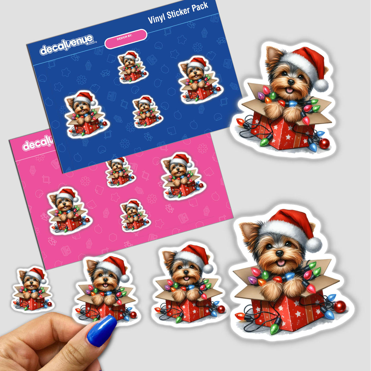 Christmas Lights Santa Yorkie in Gift Box III sticker pack featuring adorable Yorkie in a gift box adorned with Christmas lights and a Santa hat, capturing festive charm. Available as stickers or digital artwork.