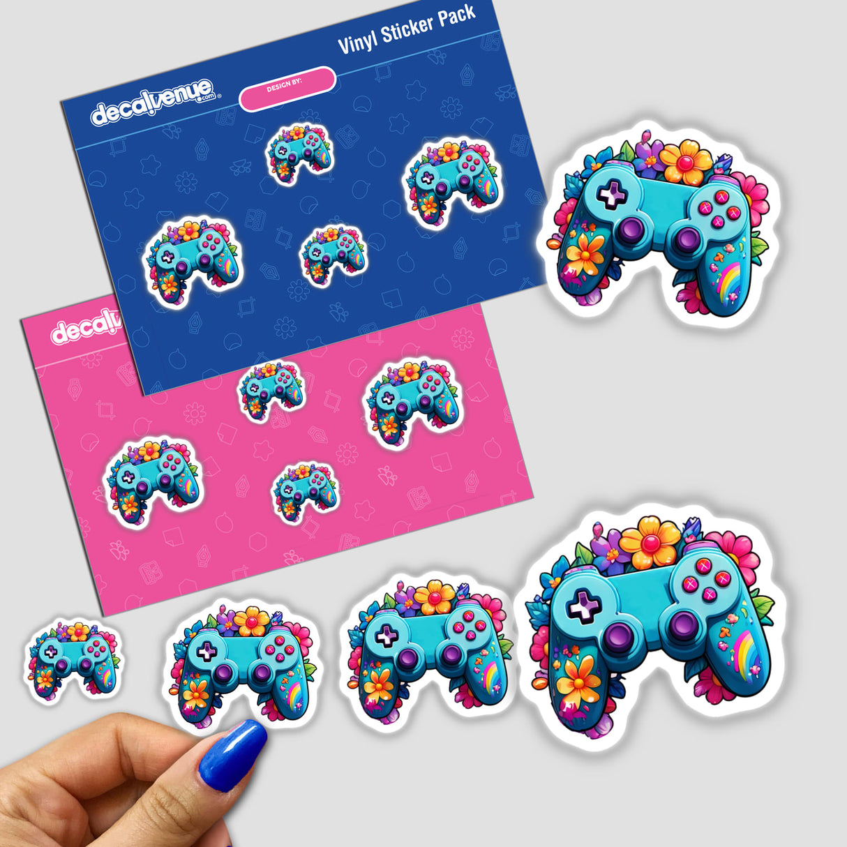 Gaming Vibes: Rainbow Floral Splash Controller Sticker featuring a video game controller adorned with vibrant flowers, shown on a hand and paper.