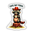 Cartoon raccoon holding a coffee cup with the quote Cute But Feral, available as stickers or digital artwork from Decal Venue.