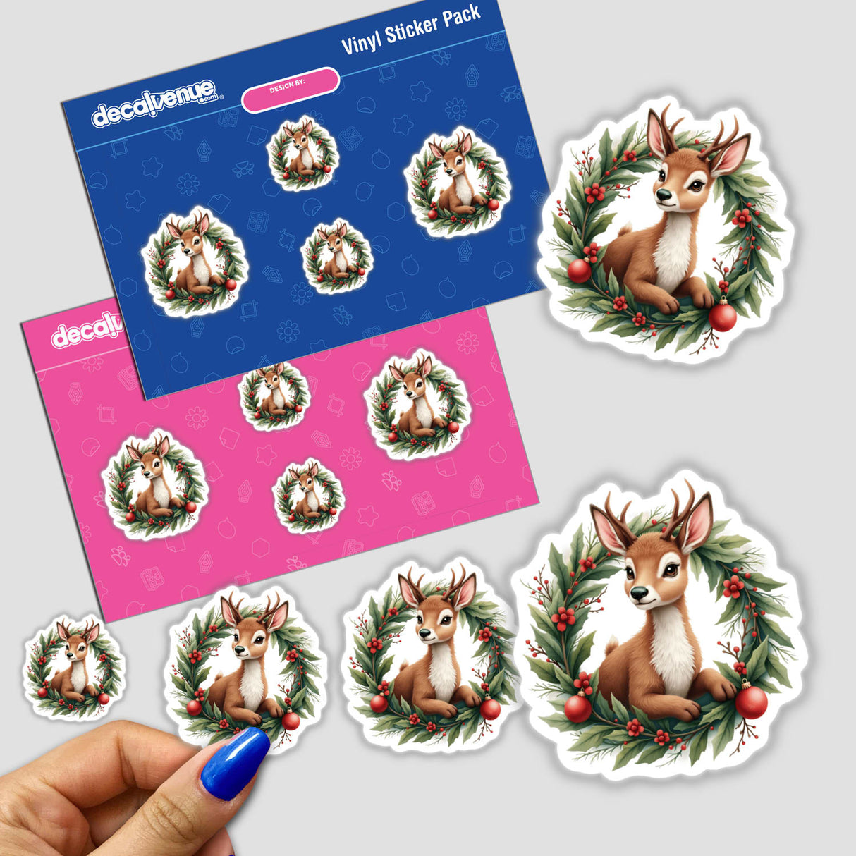 Sticker featuring a cartoon reindeer nestled in a Christmas wreath, available as part of Decal Venue's unique sticker and digital art collection, titled Reindeer in a Christmas Wreath.