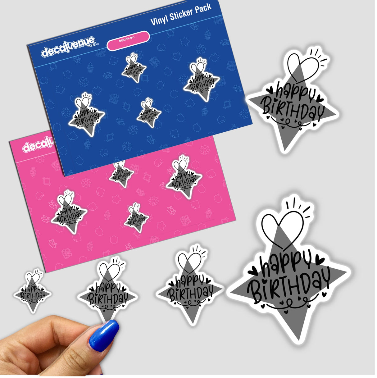 Sticker pack featuring Happy Birthday in black writing, alongside star and heart designs, displayed with other stickers on a surface.