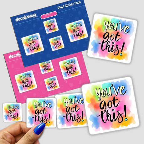 Hand holding the You’ve Got This Inspirational Quote Art sticker pack, featuring vibrant designs with motivational text. Available as stickers or digital artwork from Decal Venue.