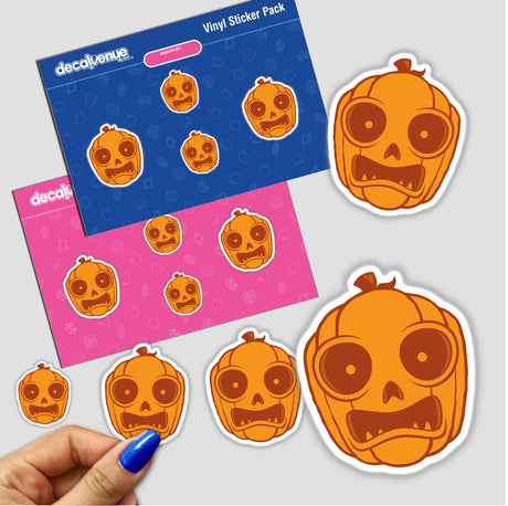 Halloween Jack-O-Lantern stickers featuring cartoon pumpkin faces, held in a hand. Perfect for decorating with playful Halloween themes.