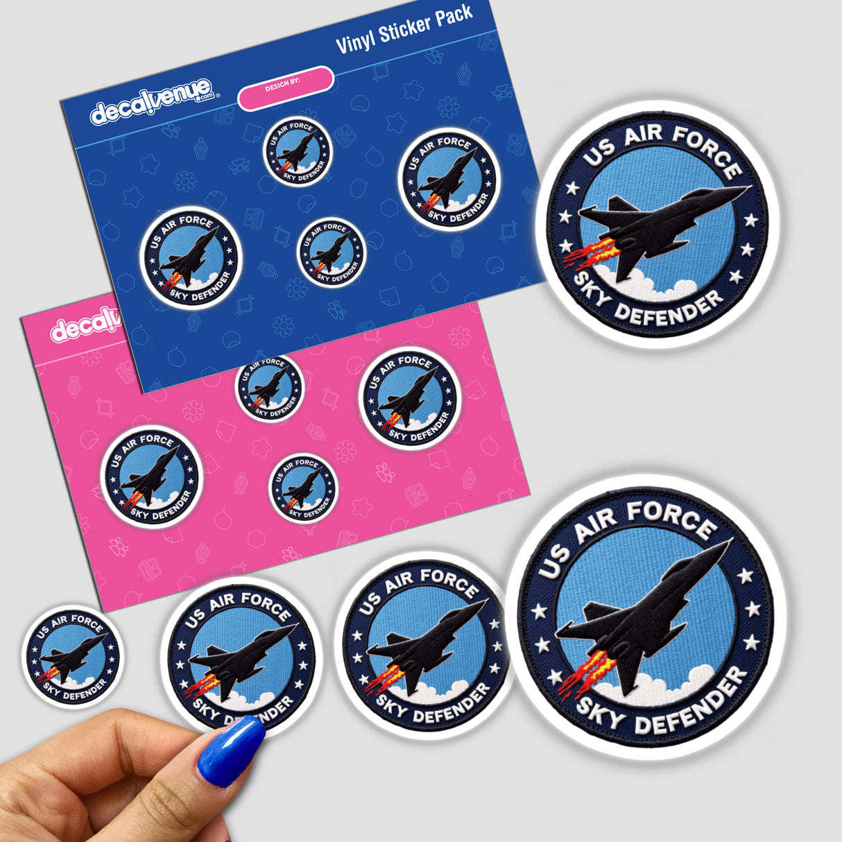 Sticker titled 0011 - US AIR FORCE SKY DEFENDER, featuring a detailed fighter jet flying in the sky, held by a hand. Available as stickers or digital artwork.