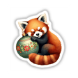 Cartoon of a red panda sleeping on a Christmas ornament, available as stickers or digital artwork from Decal Venue.