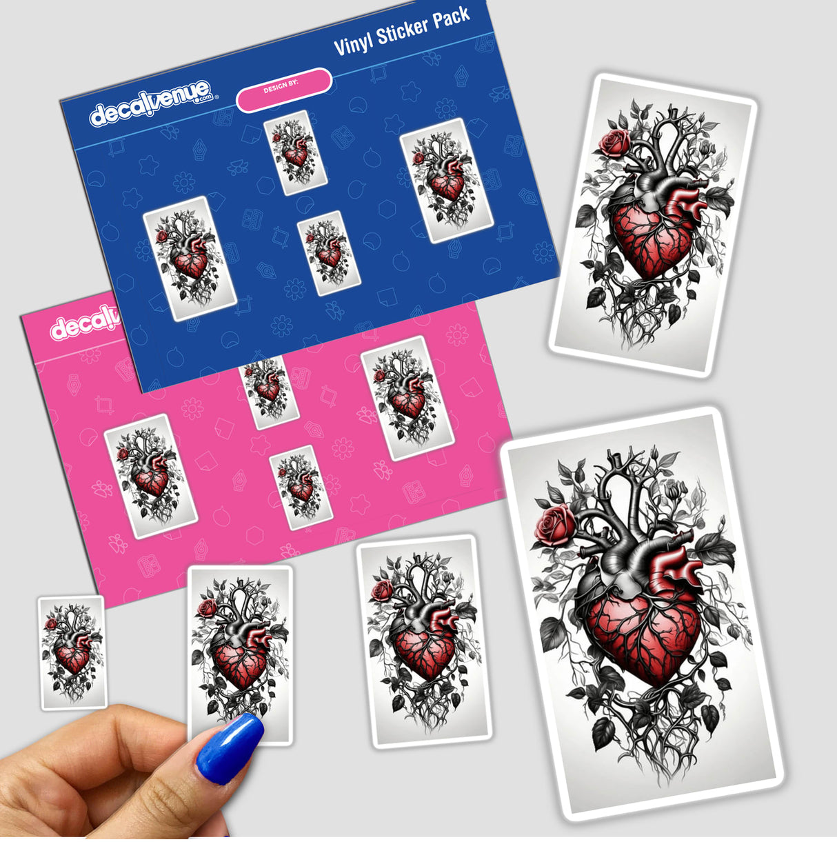 Hand holding a Thorns & Vines Heart sticker pack, featuring intricate heart designs with roses and vines.