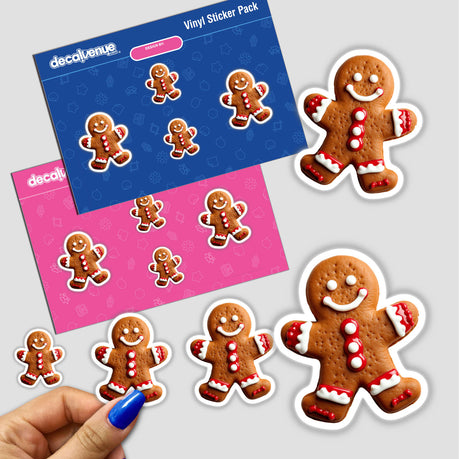 Person holding Gingerbread Man Christmas Holiday Cheer Cookie Design sticker pack featuring various gingerbread men with white and red frosting, available as stickers or digital artwork.