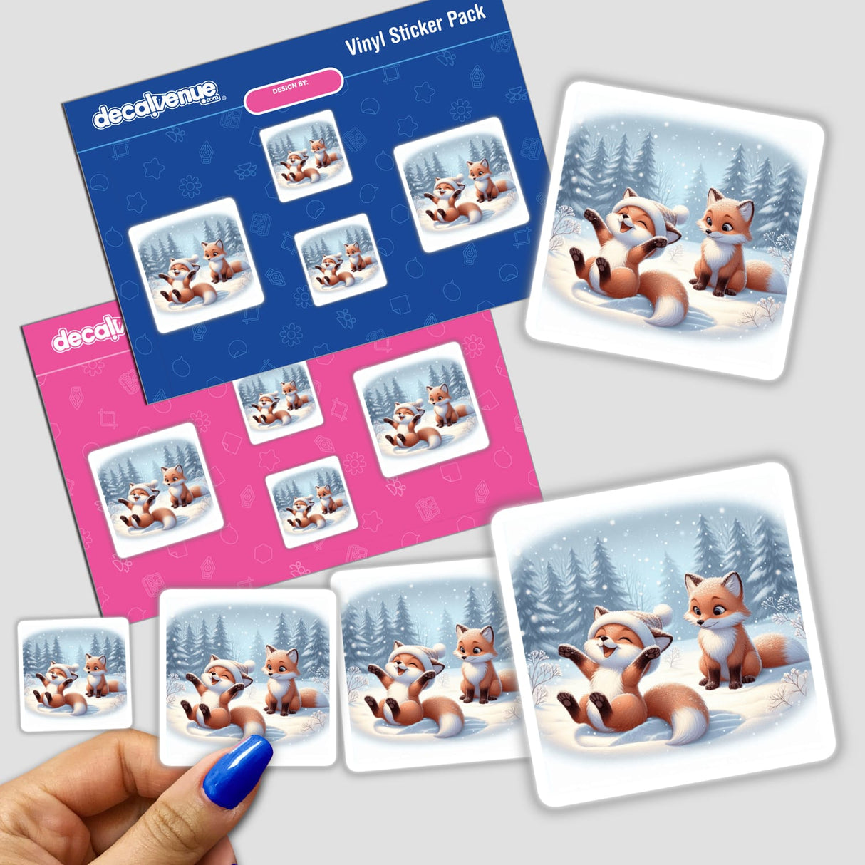 Two Foxes Playing stickers depicting cartoon foxes frolicking in the snow, available as stickers or digital artwork from Decal Venue.