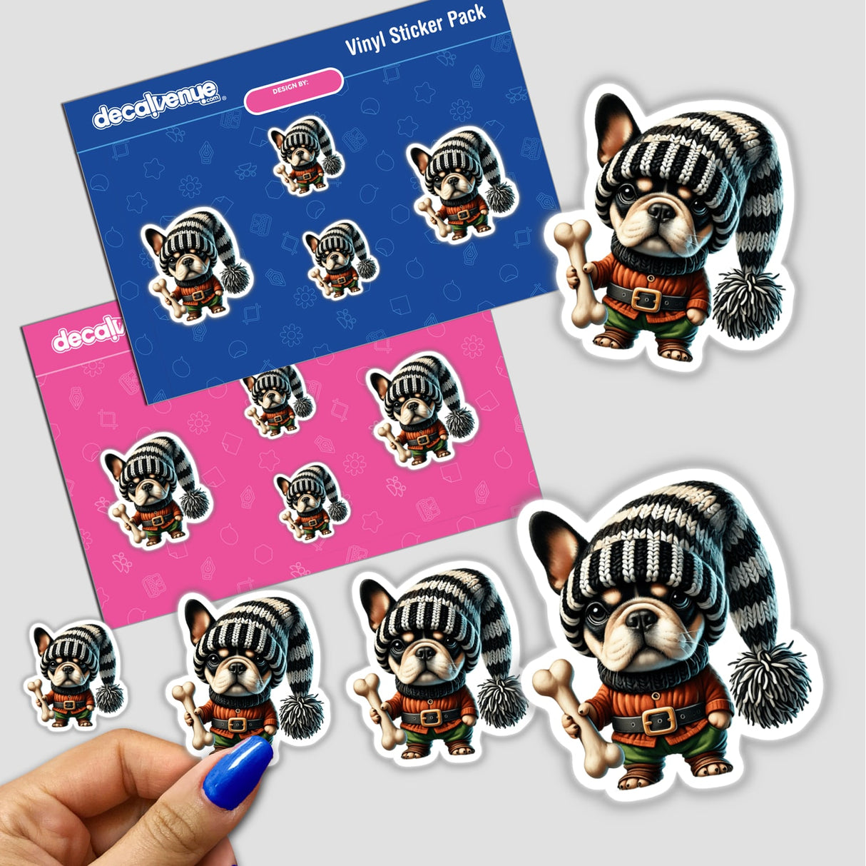 Cute digital French Bulldog gnome stickers with striped hats and dog bones, displayed on a Decal Venue product packaging.