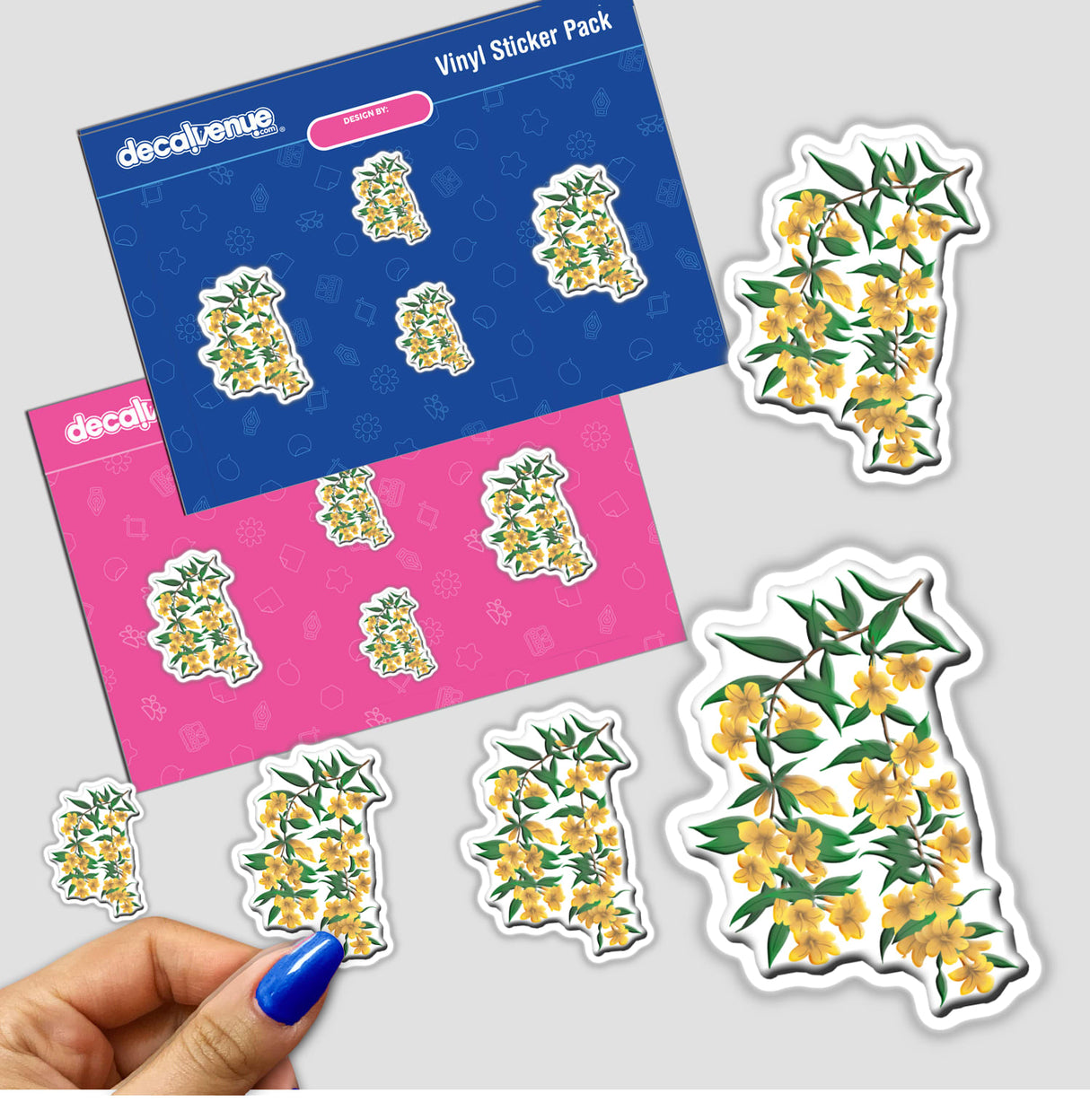 Hand holding an American Wild Flowers sticker pack featuring vibrant yellow floral designs, available as stickers or digital artwork.