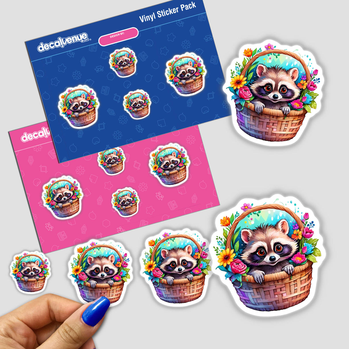 Basket Buddy: Cute Racoon Nestled in a Basket stickers, featuring a raccoon surrounded by flowers. Available as individual stickers or in a multi-sticker pack.