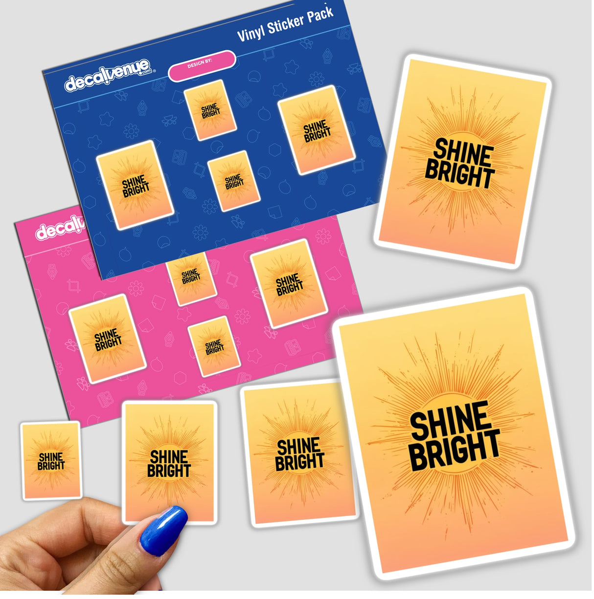 Minimalist Sunburst ‘Shine Bright’ Poster in Yellow and Orange Gradient, shown in a sticker format held by a hand, emphasizing its vibrant design and inspirational message.