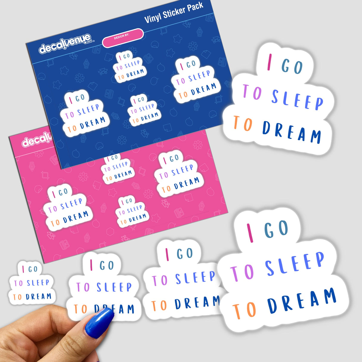 Hand holding I Go To Sleep To Dream stickers, showcasing varied text designs, available as physical stickers or digital artwork from Decal Venue.