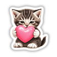 Tabby Kitten Holding Pink Heart depicted as a cute cat clutching a heart shape, available as a sticker or digital artwork from Decal Venue, known for unique vinyl and digital creations.