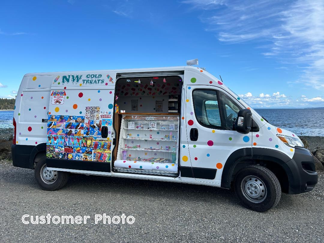 Colorful polka dot pattern covers a mobile food truck or van by Decal Venue, showcasing a variety of stickers and wall decals.