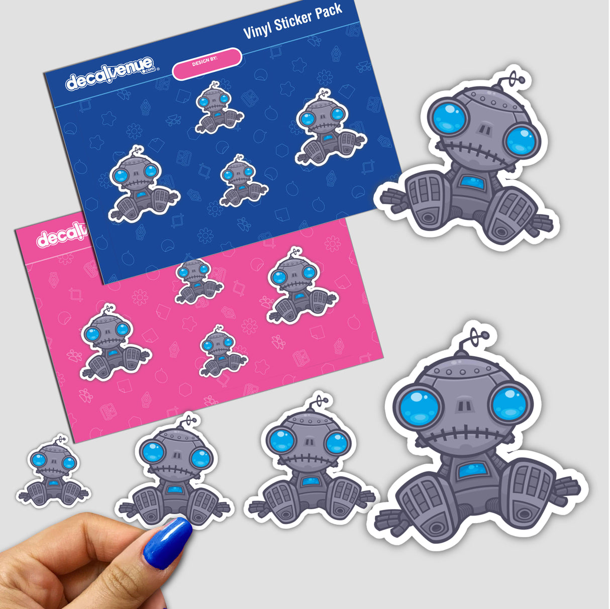 Sticker pack featuring the Sad Robot with various cartoon robot designs, held in a hand, showcasing Decal Venue's unique art style.