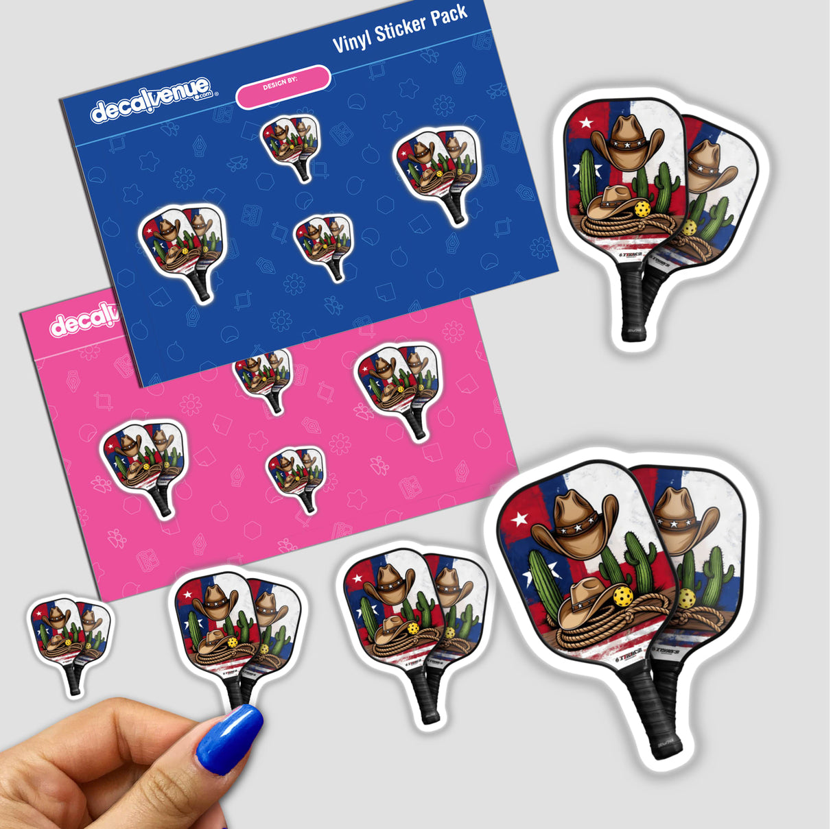 Pickleball Paddles Texas Theme sticker pack featuring paddles adorned with cowboy hats and cactuses, showcased through a close-up view with a hand holding a sticker.