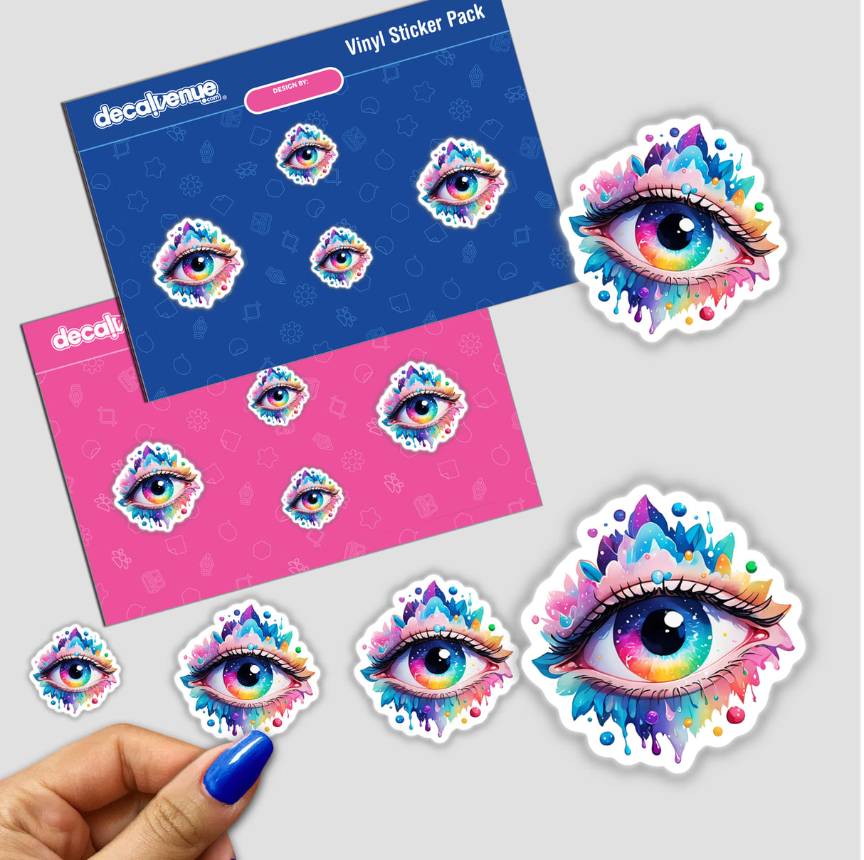 Colorful Splash Third Eye Sticker held by a hand, showcasing intricate, vibrant eye design; available as physical stickers or digital artwork from Decal Venue.