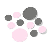 Baby pink and grey polka dot circle wall decals on white background.